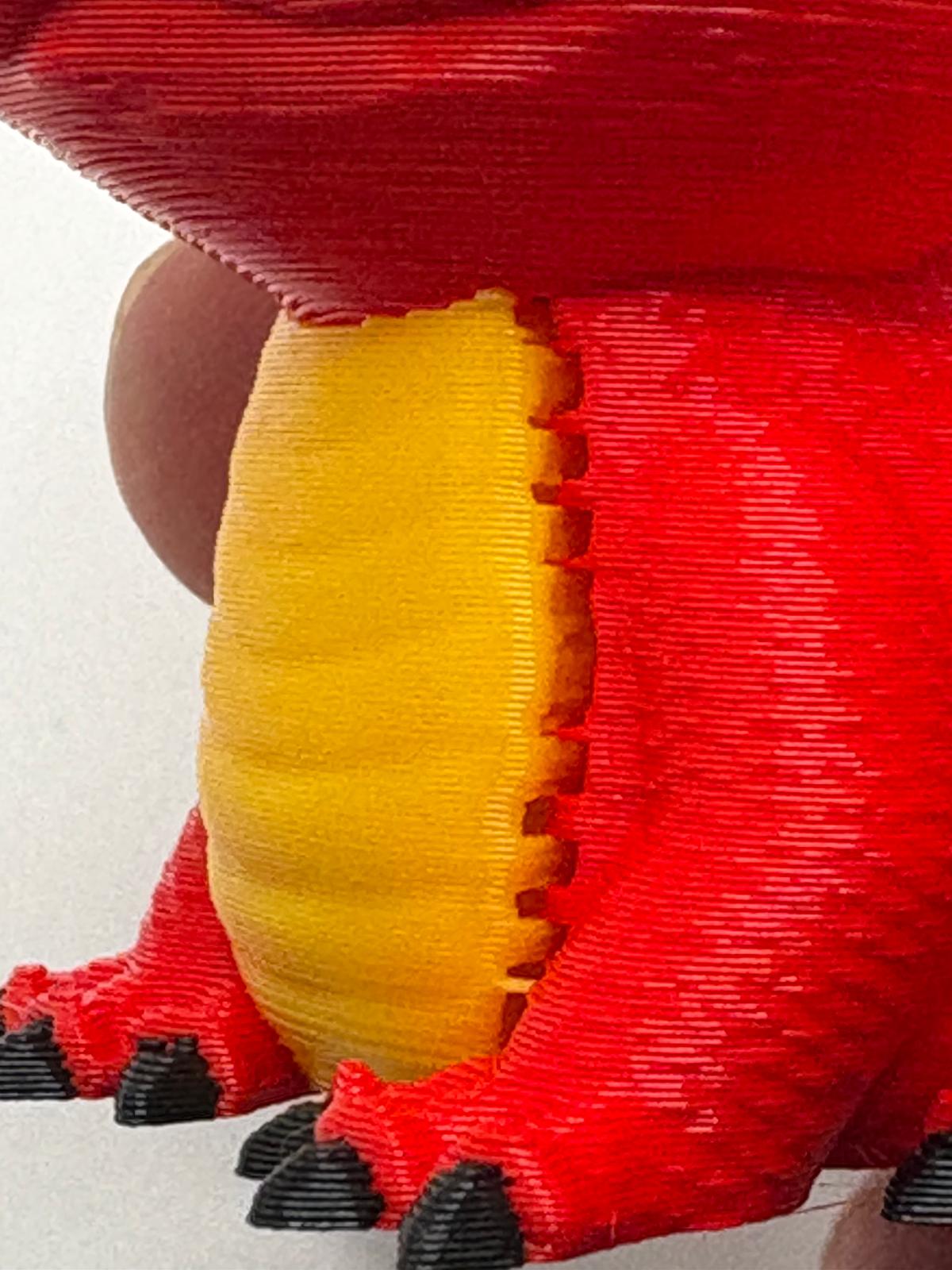 Close view before adjustment showing repeated bumps where the red and yellow belly areas meet