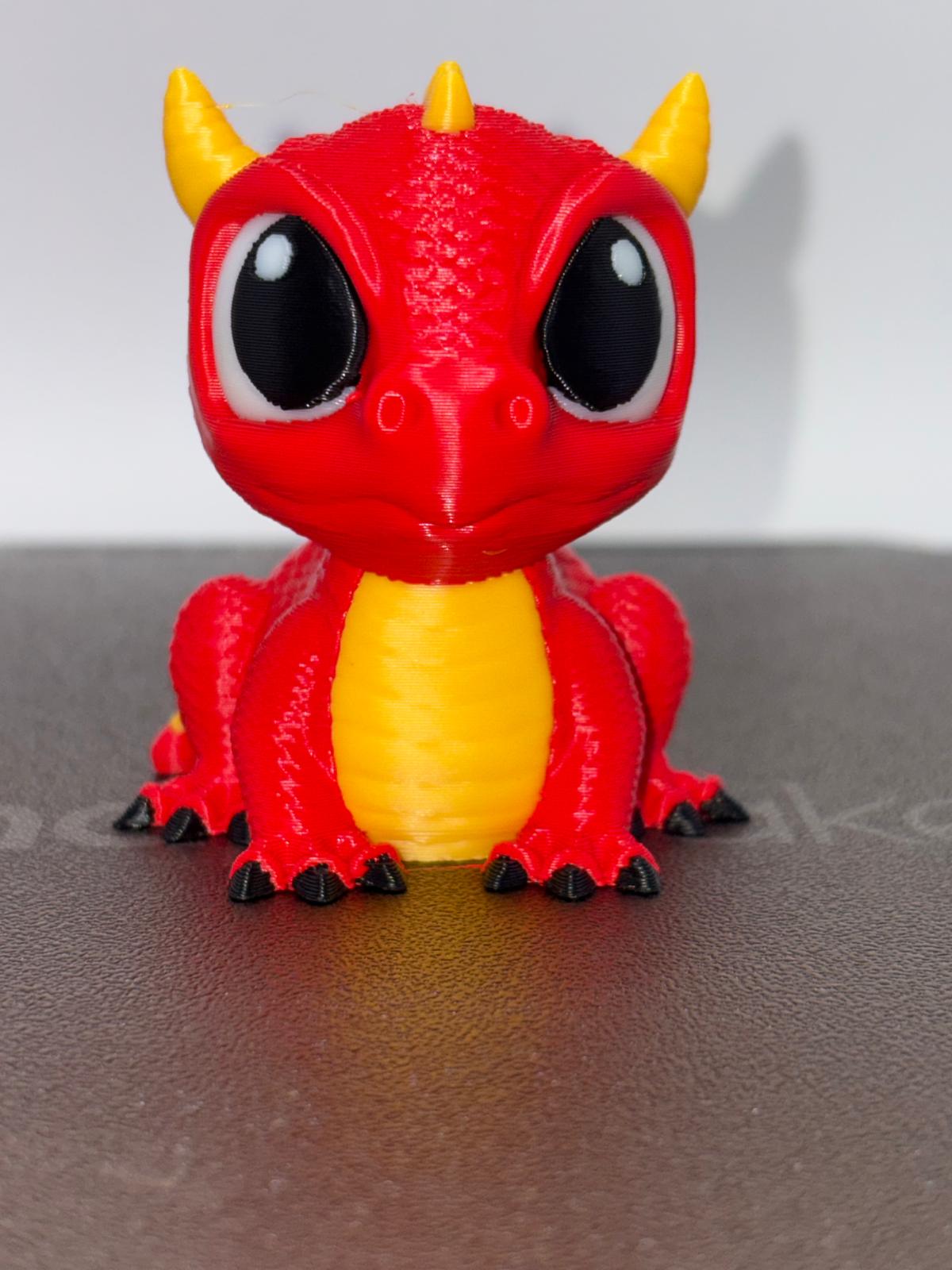 Front view of the verified red, yellow, black, and white Cute Dragon print