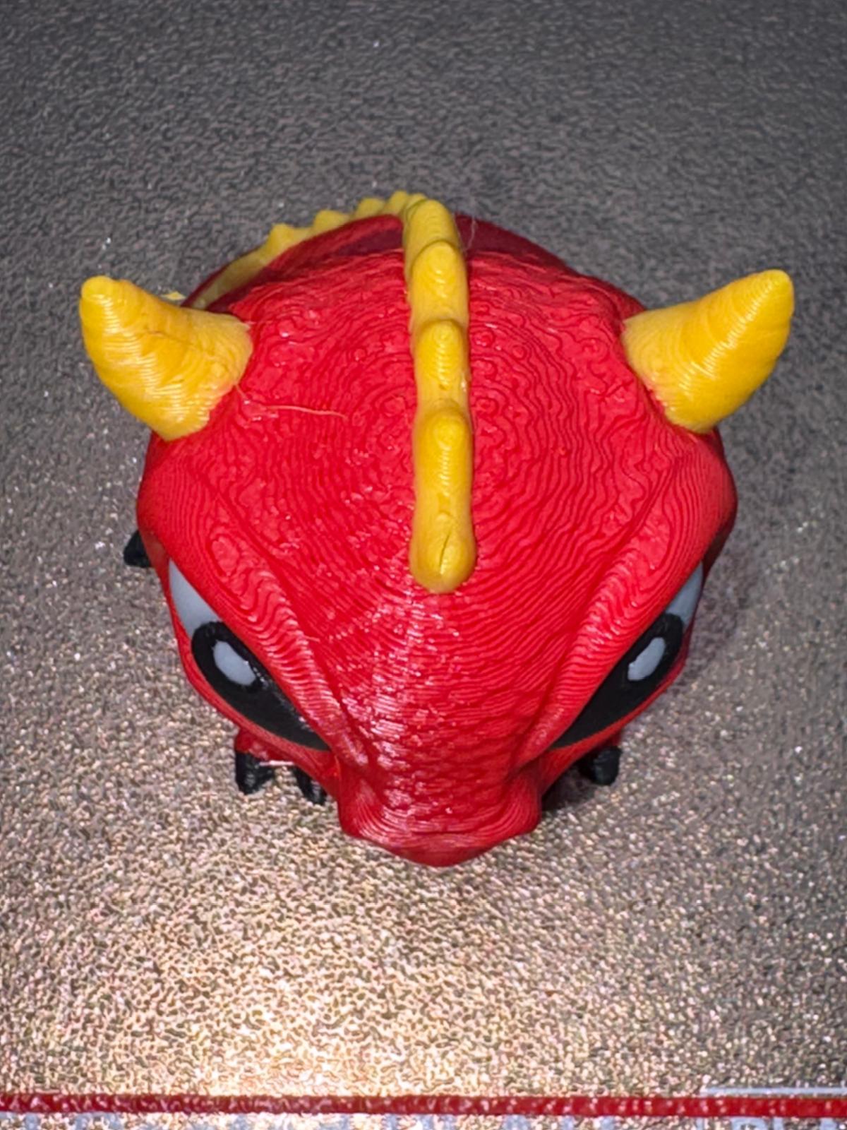 Top view showing the verified horns, head surface, eyes, and yellow spine